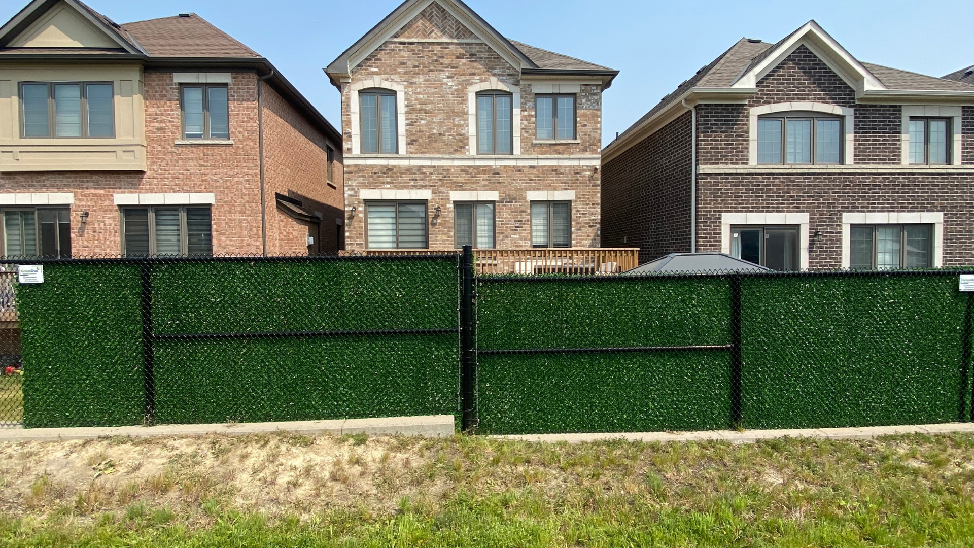 Installing artificial grass fence cover on metal chain link fence using simple fasteners